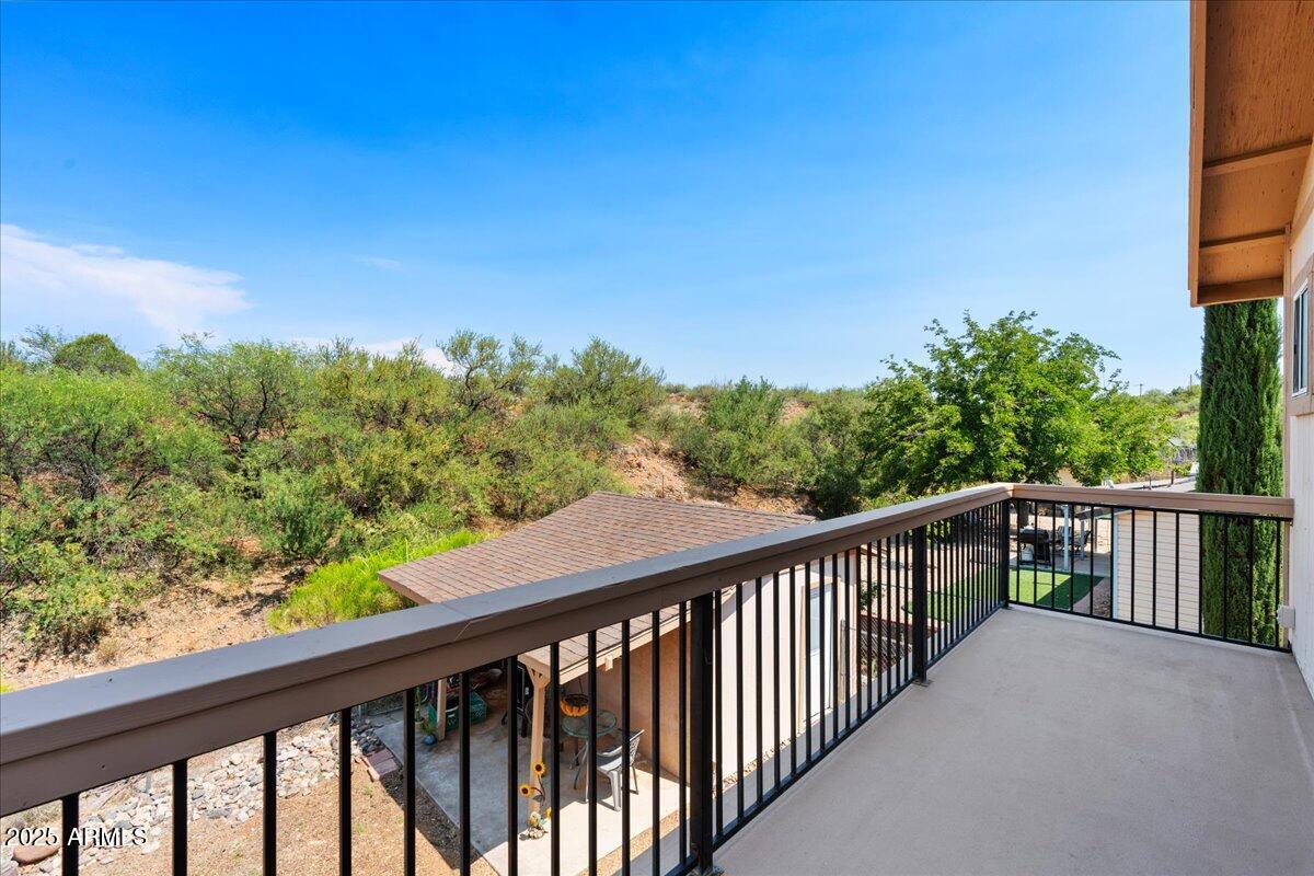 2527 Rio Verde Drive Cottonwood, AZ 86326 - Photo 28 of 43 a balcony with trees in the background