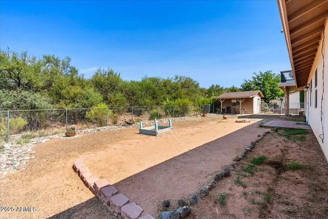 a view of a house with yard and sitting area