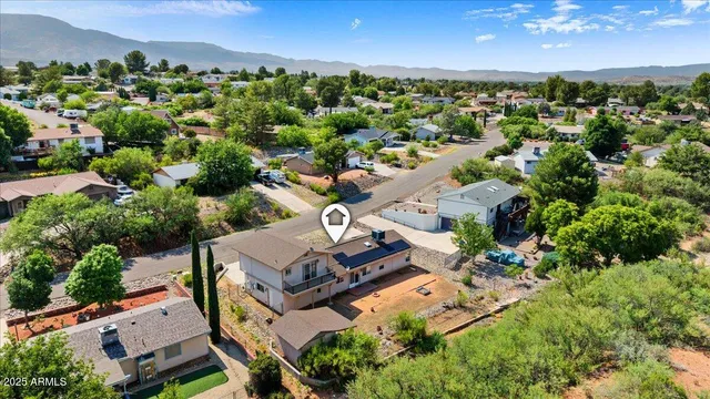 an aerial view of a house with a garden