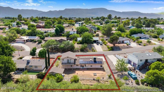 an aerial view of a house with mountain view