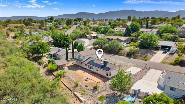an aerial view of a residential houses with outdoor space and street view