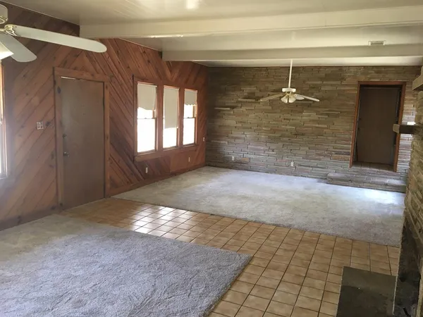 a view of a elevator with wooden floor