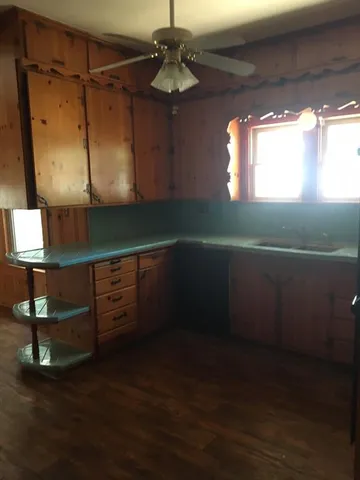a kitchen with a sink and cabinets