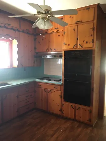 a kitchen with a sink and a window
