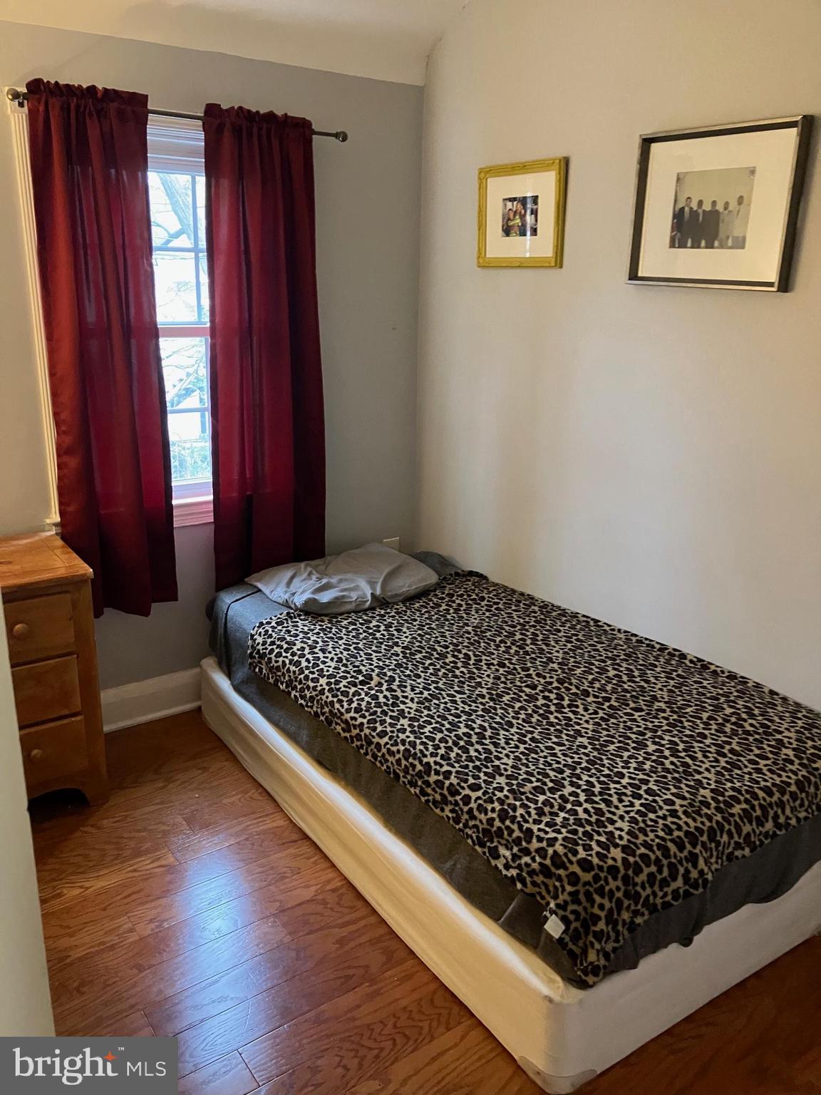 5111 Underwood Road Baltimore, MD 21212 - Photo 12 of 20 a bedroom with bed and wooden floor