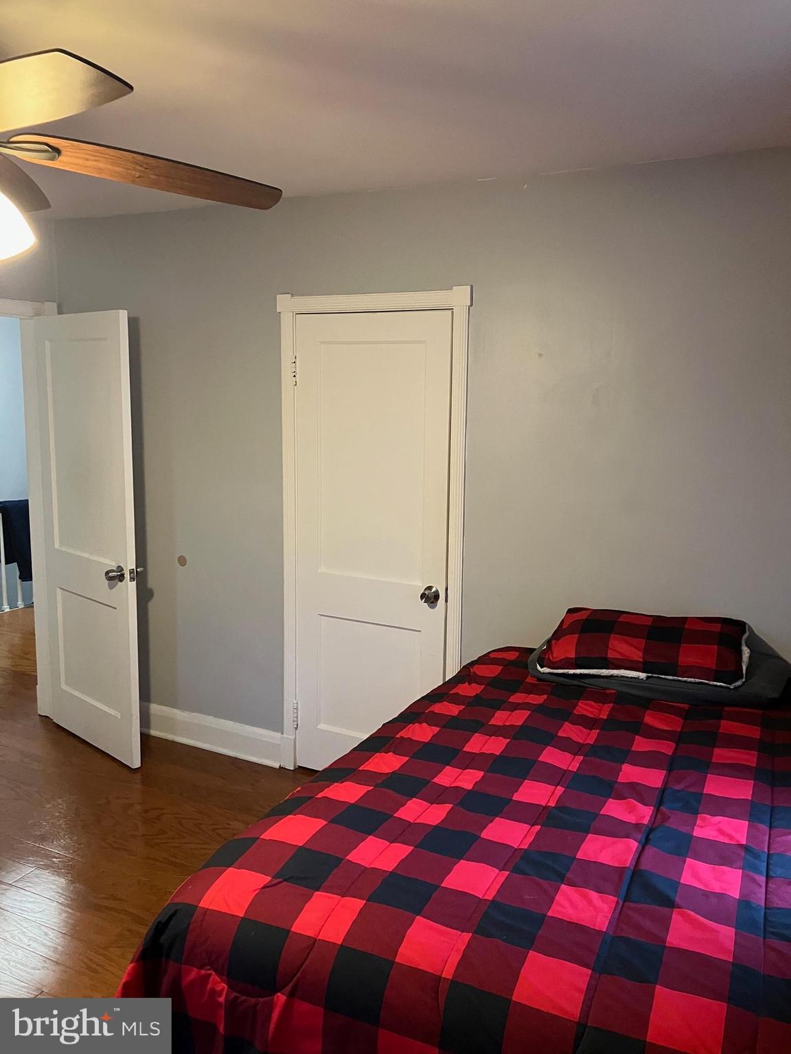 5111 Underwood Road Baltimore, MD 21212 - Photo 14 of 20 a bedroom with a bed and a walk in closet