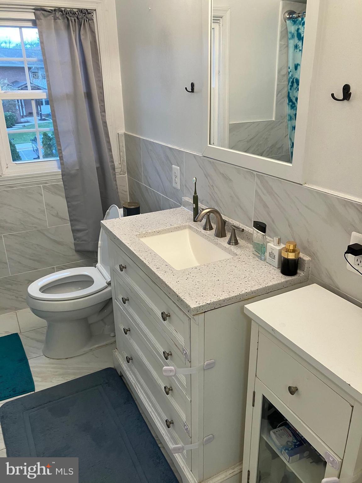 5111 Underwood Road Baltimore, MD 21212 - Photo 16 of 20 a bathroom with a sink and a toilet