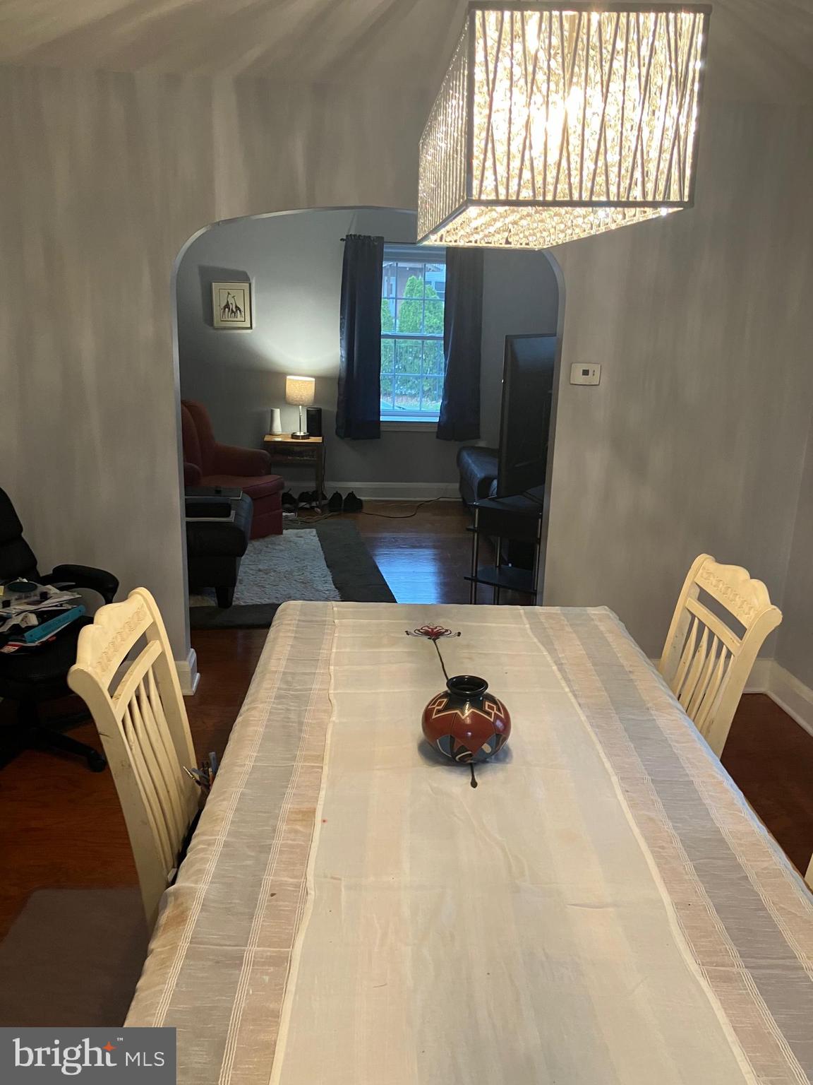 5111 Underwood Road Baltimore, MD 21212 - Photo 6 of 20 a bedroom with a bed and a chandelier