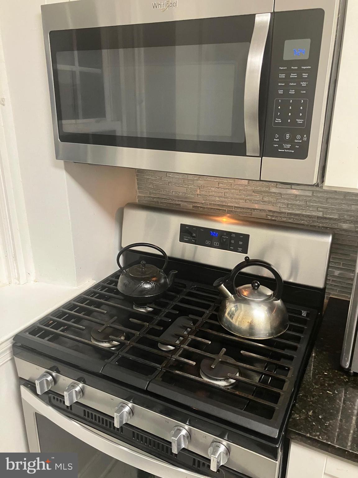 5111 Underwood Road Baltimore, MD 21212 - Photo 8 of 20 a stove top oven sitting inside of a kitchen