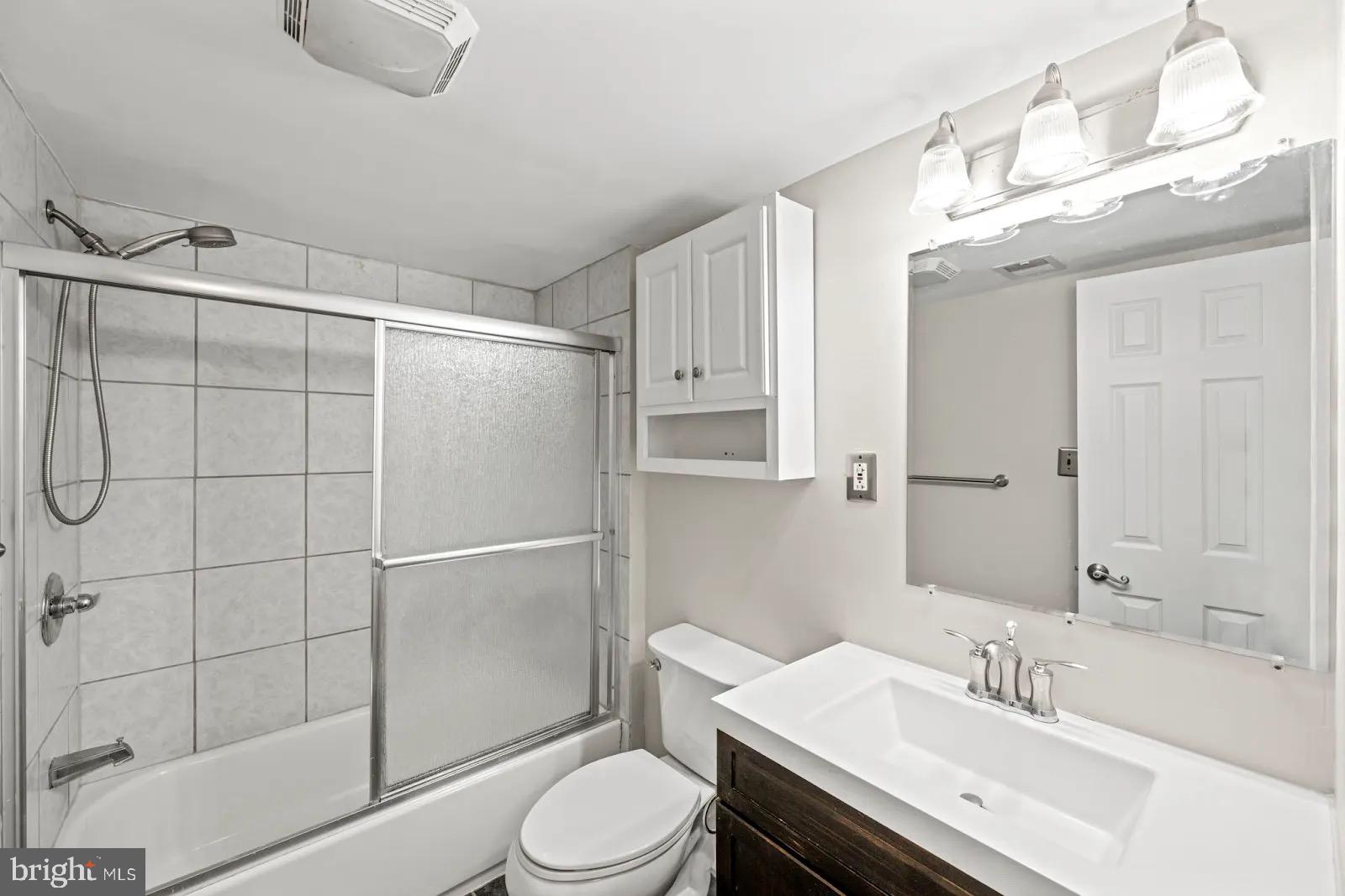 2001 Fort Davis Street Southeast, Unit 102 Washington, DC 20020 - Photo 20 of 30 a bathroom with a sink toilet and shower