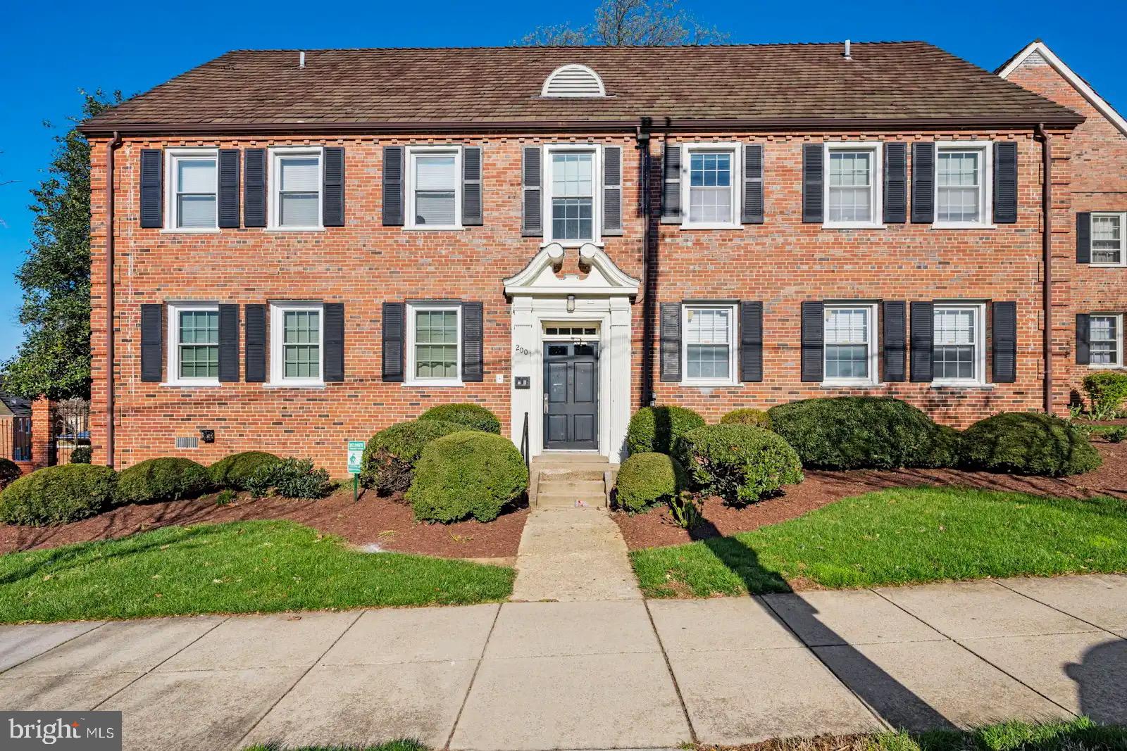 2001 Fort Davis Street Southeast, Unit 102 Washington, DC 20020 - Photo 2 of 30 a front view of a house with garden