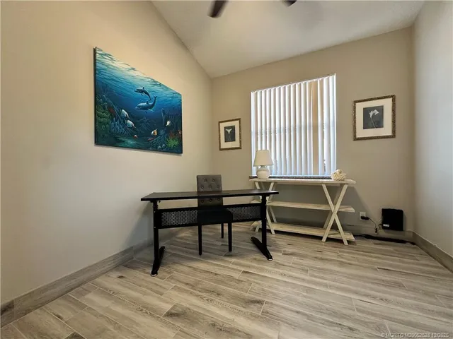 a workspace with wooden floor and a workspace