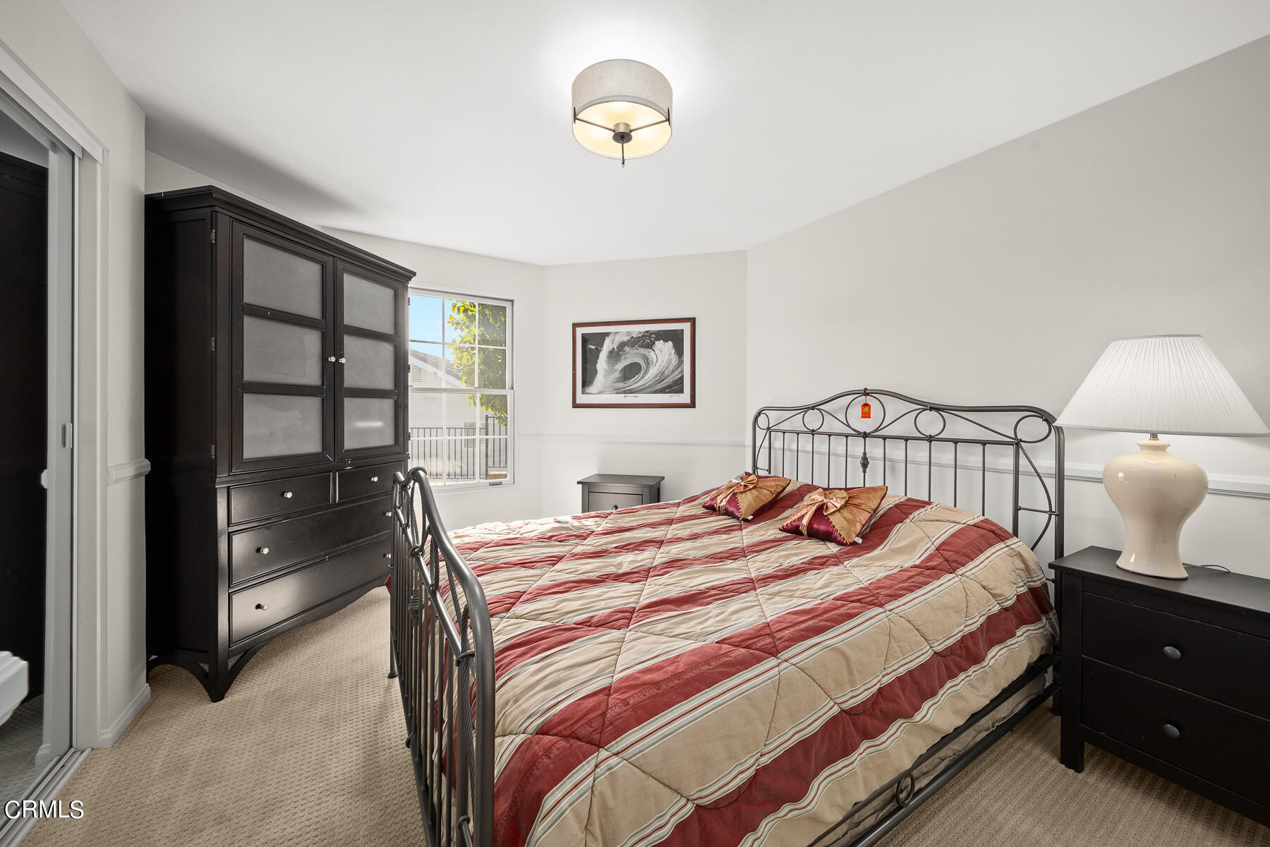 3337 Haven Way Burbank, CA 91504 - Photo 47 of 63 a bedroom with a bed and a lamp next to a window