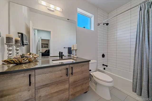 a kitchen with stainless steel appliances kitchen island granite countertop a sink dishwasher stove and refrigerator