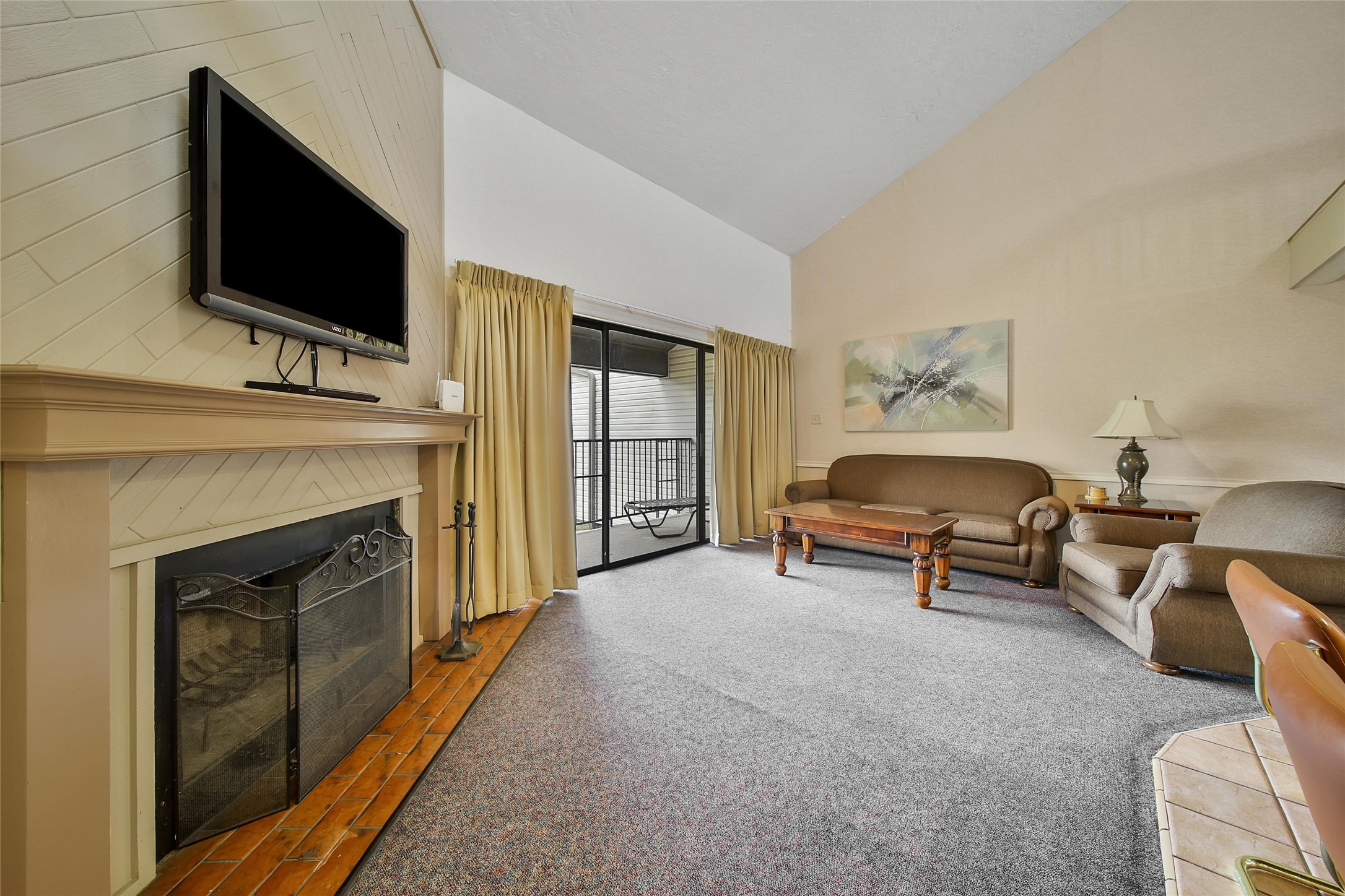 1000 April Sound Boulevard Conroe, TX 77356 - Photo 36 of 46 a living room with furniture and a fireplace