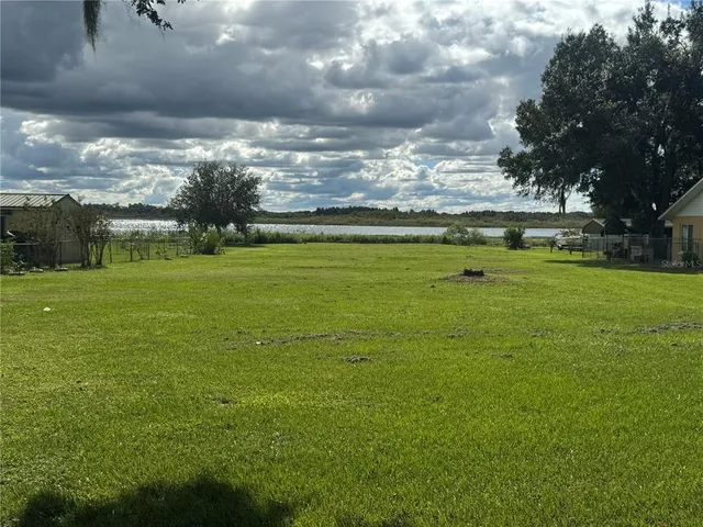 a view of a building with a big yard