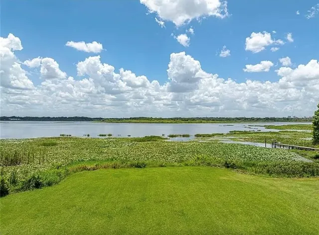 a view of a golf course with a lake