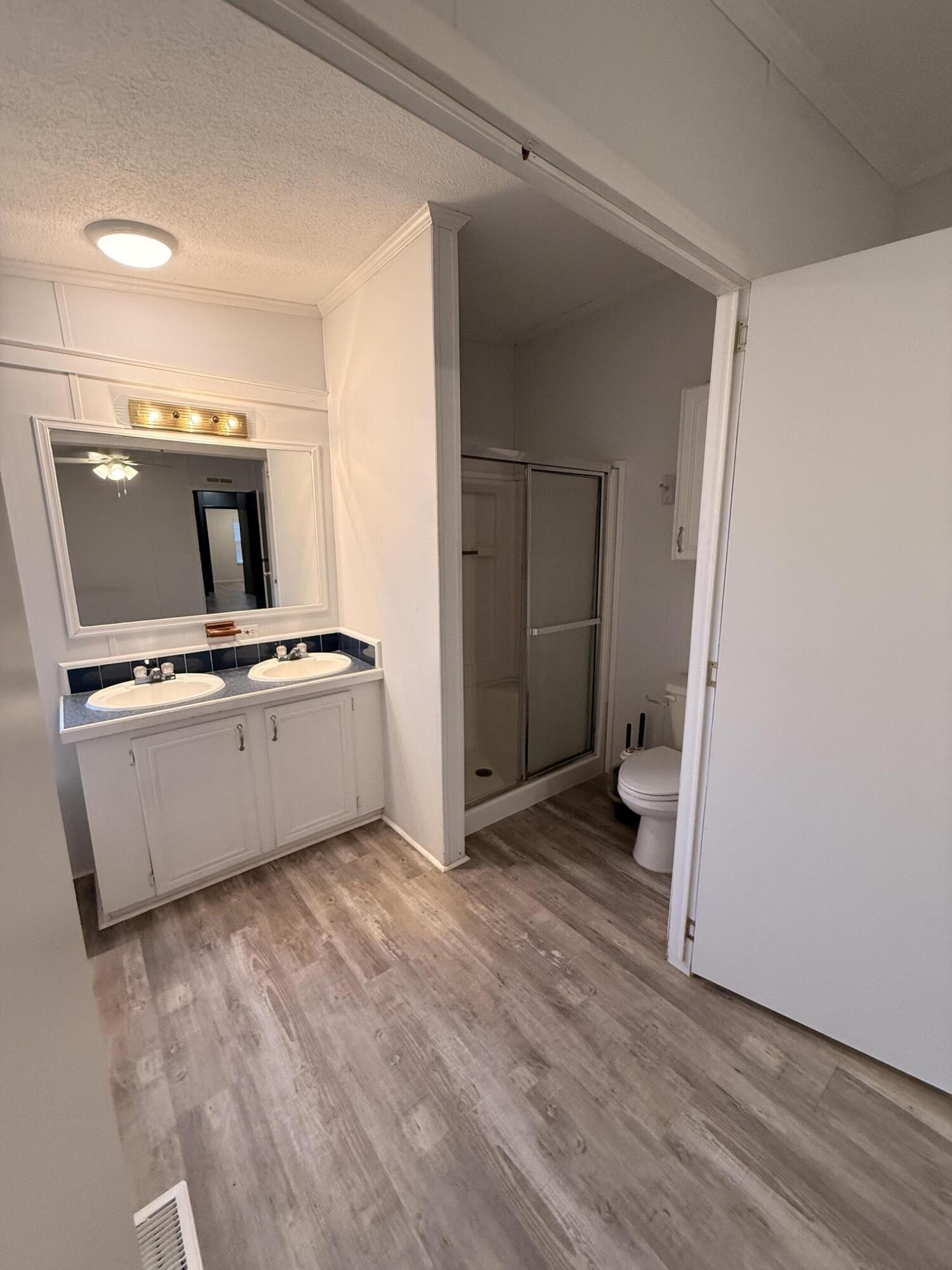 300 Ridgewood Avenue Mary Esther, FL 32569 - Photo 12 of 15 a view of kitchen with sink microwave and refrigerator