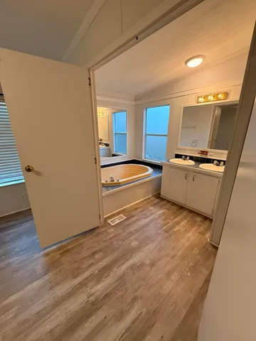 a view of a kitchen with a sink and dishwasher
