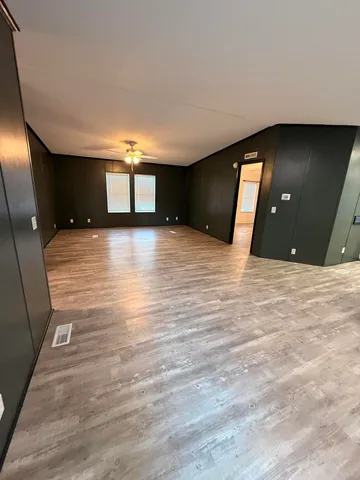 a view of a room with a flat screen tv