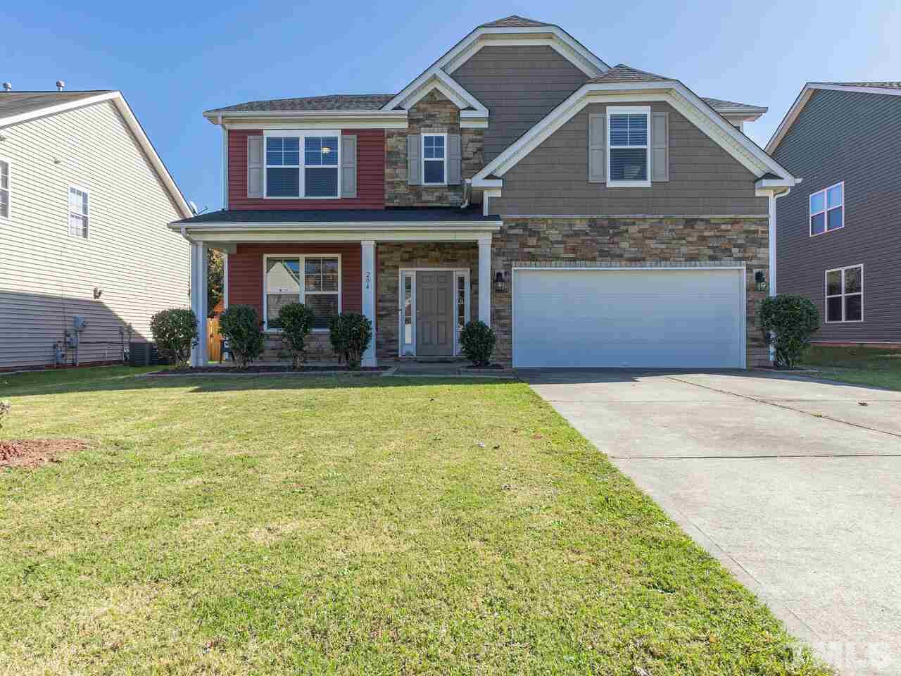 204 Hope Valley Road Knightdale, NC 27545 - Photo 1 of 30 a front view of a house with a yard