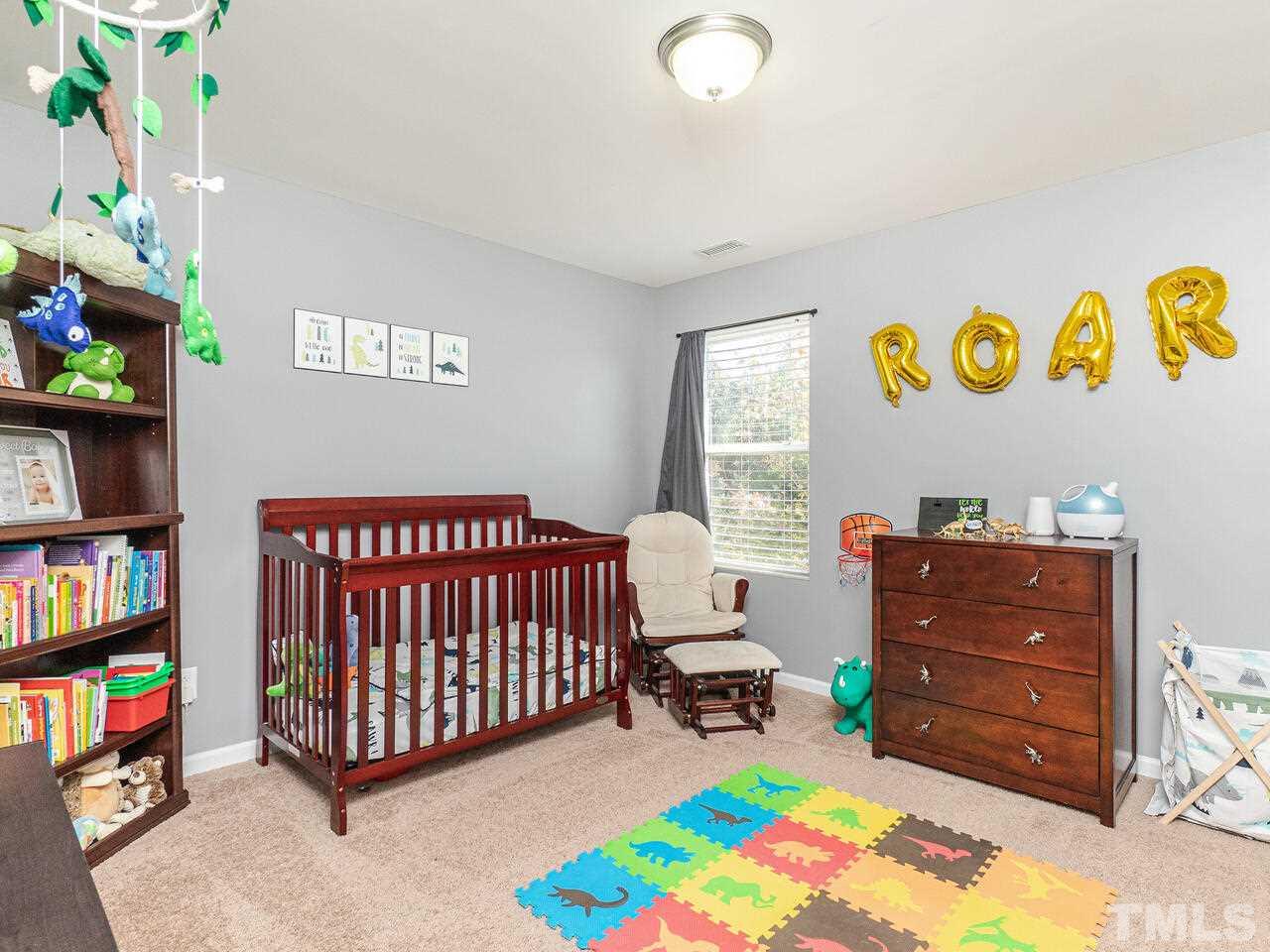 204 Hope Valley Road Knightdale, NC 27545 - Photo 19 of 30 a bedroom with a bed and a window