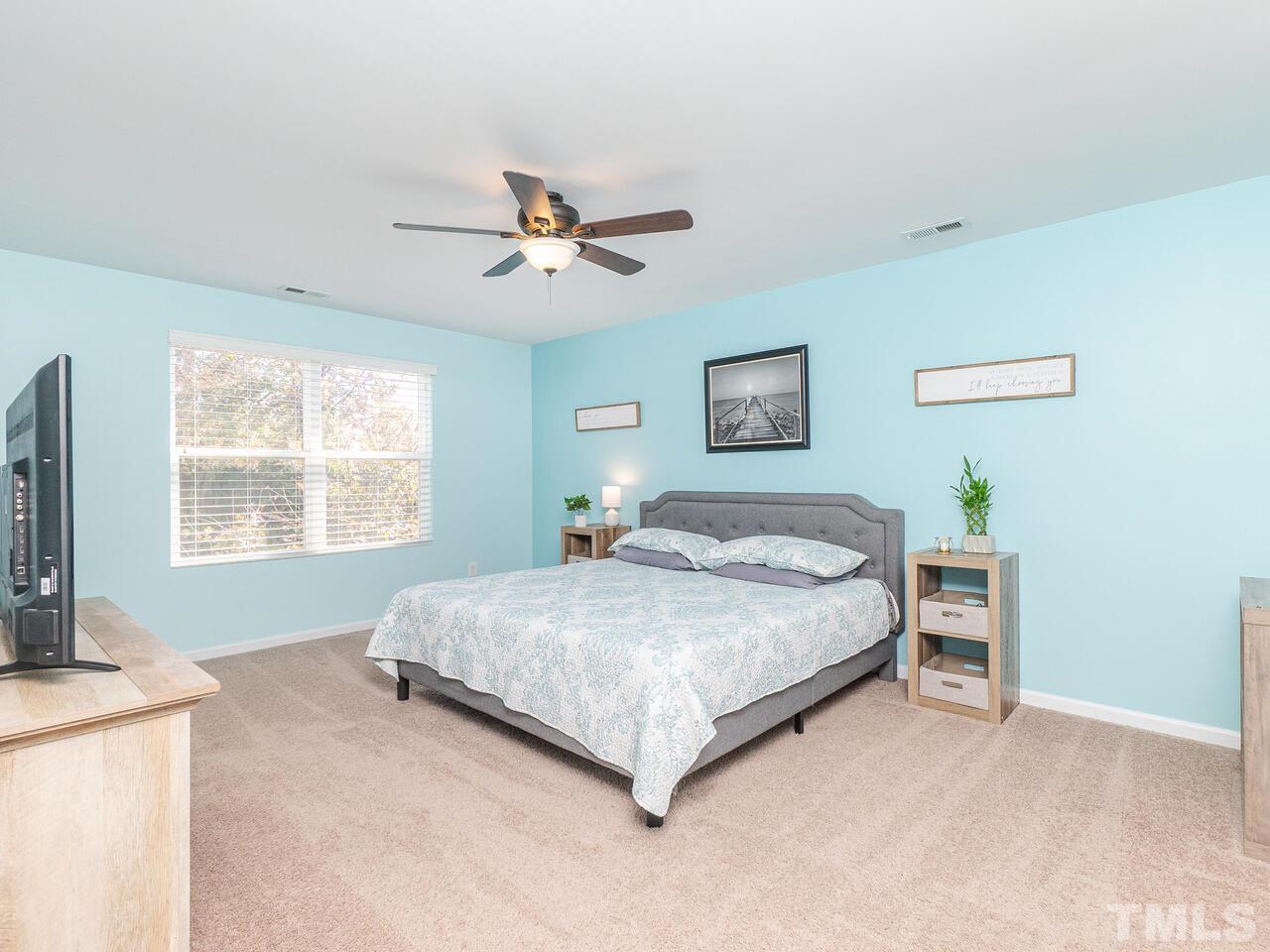 204 Hope Valley Road Knightdale, NC 27545 - Photo 20 of 30 a spacious bedroom with a large bed and a window