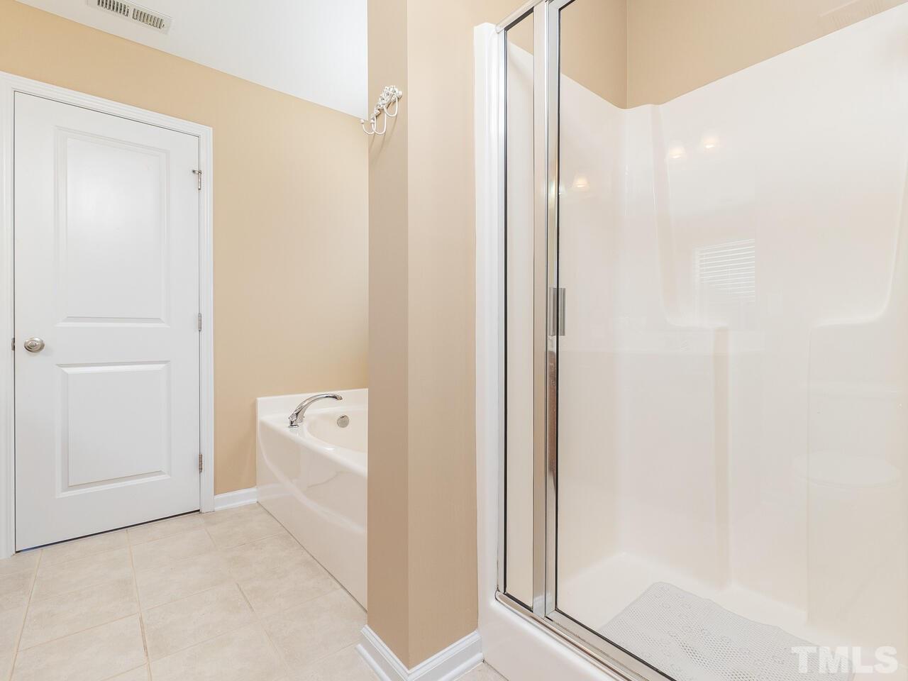204 Hope Valley Road Knightdale, NC 27545 - Photo 23 of 30 a bathroom with a tub shower and sink