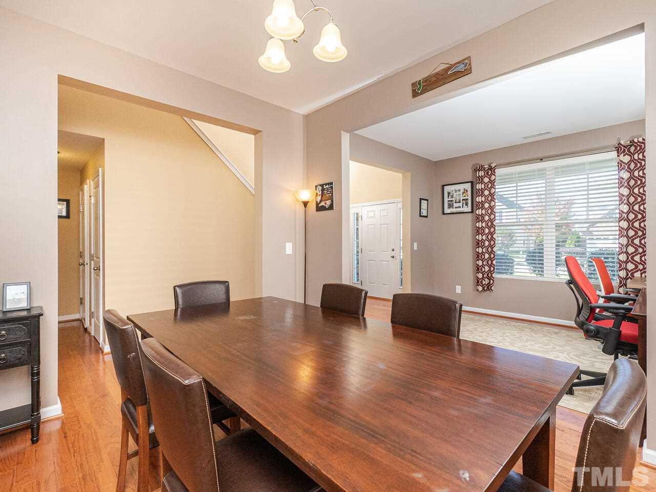 204 Hope Valley Road Knightdale, NC 27545 - Photo 6 of 30 a view of a dining room with furniture and wooden floor