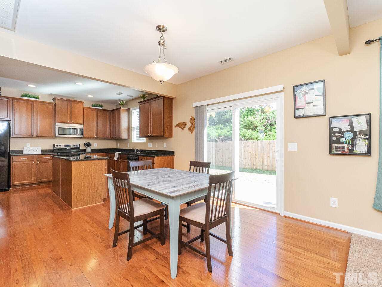 204 Hope Valley Road Knightdale, NC 27545 - Photo 10 of 30 a view of a dining room with furniture window and wooden floor