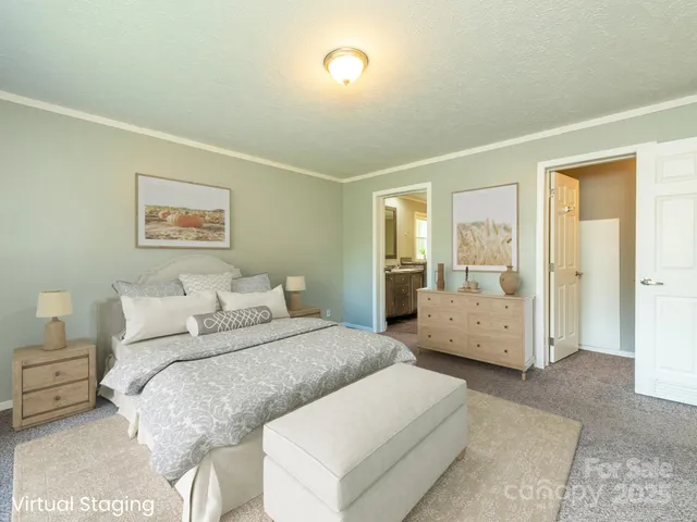 a bedroom with a large bed and a couch