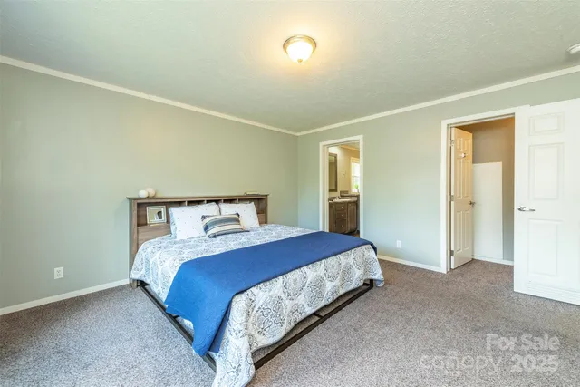 a bedroom with a bed and a night stand