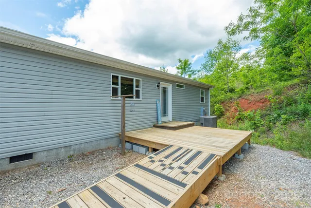 an aerial view of a house with yard