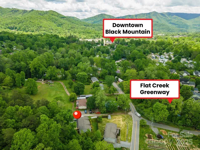 a sign that is sitting on a lush green field