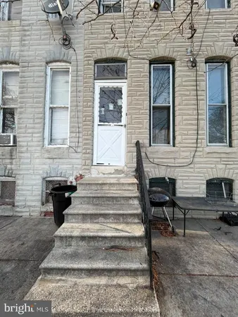 a front view of a house with stairs