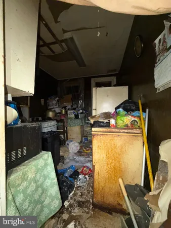 a kitchen with a sink appliances and cabinets