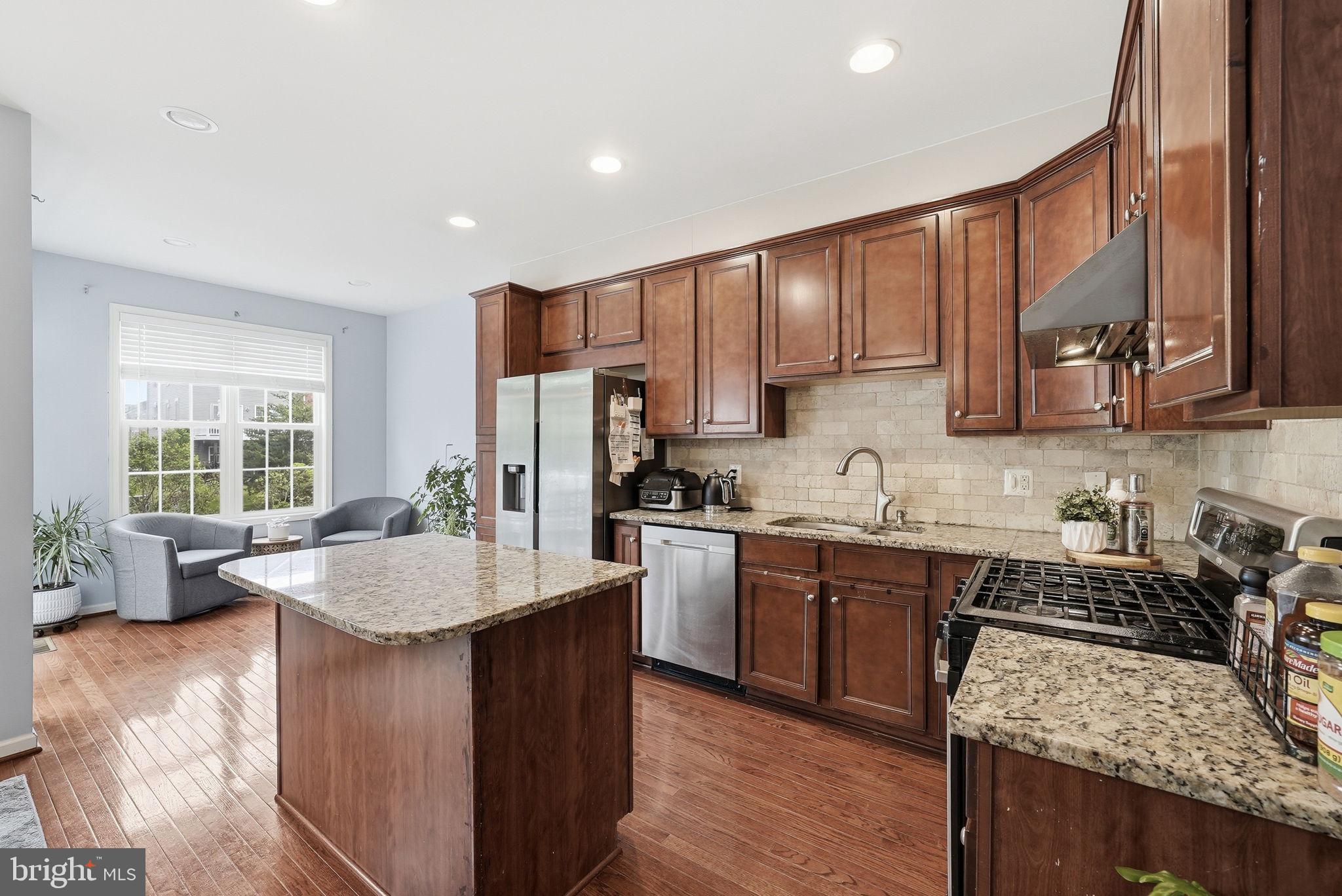 25077 Prairie Fire Square Aldie, VA 20105 - Photo 6 of 15 Modern kitchen with elegant finishes.