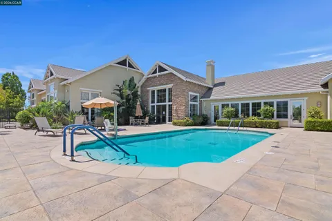 a view of outdoor space with wooden floor and windows