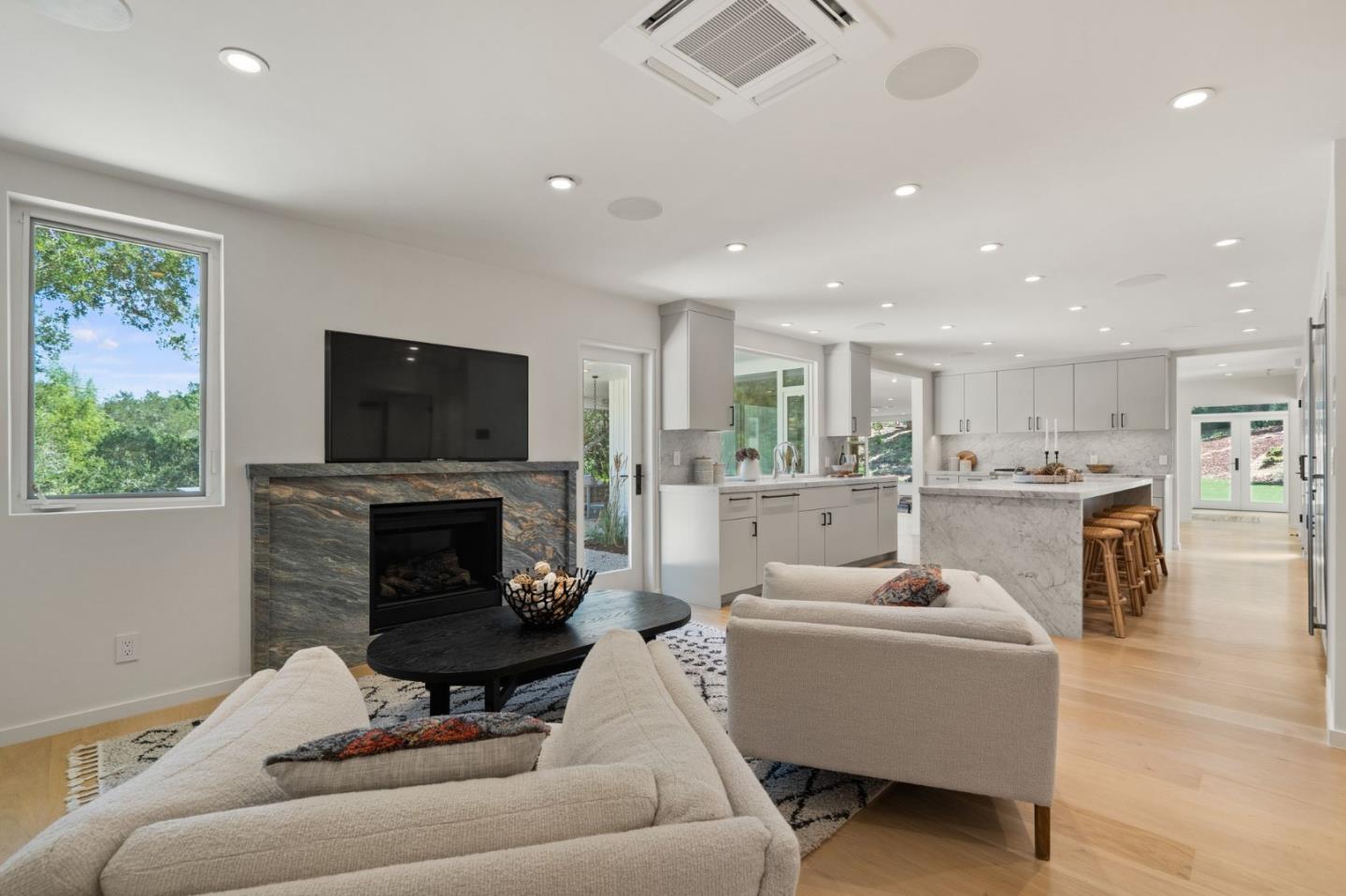 161 Eleanor Drive Woodside, CA 94062 - Photo 13 of 57 a living room with furniture a fireplace and a flat screen tv