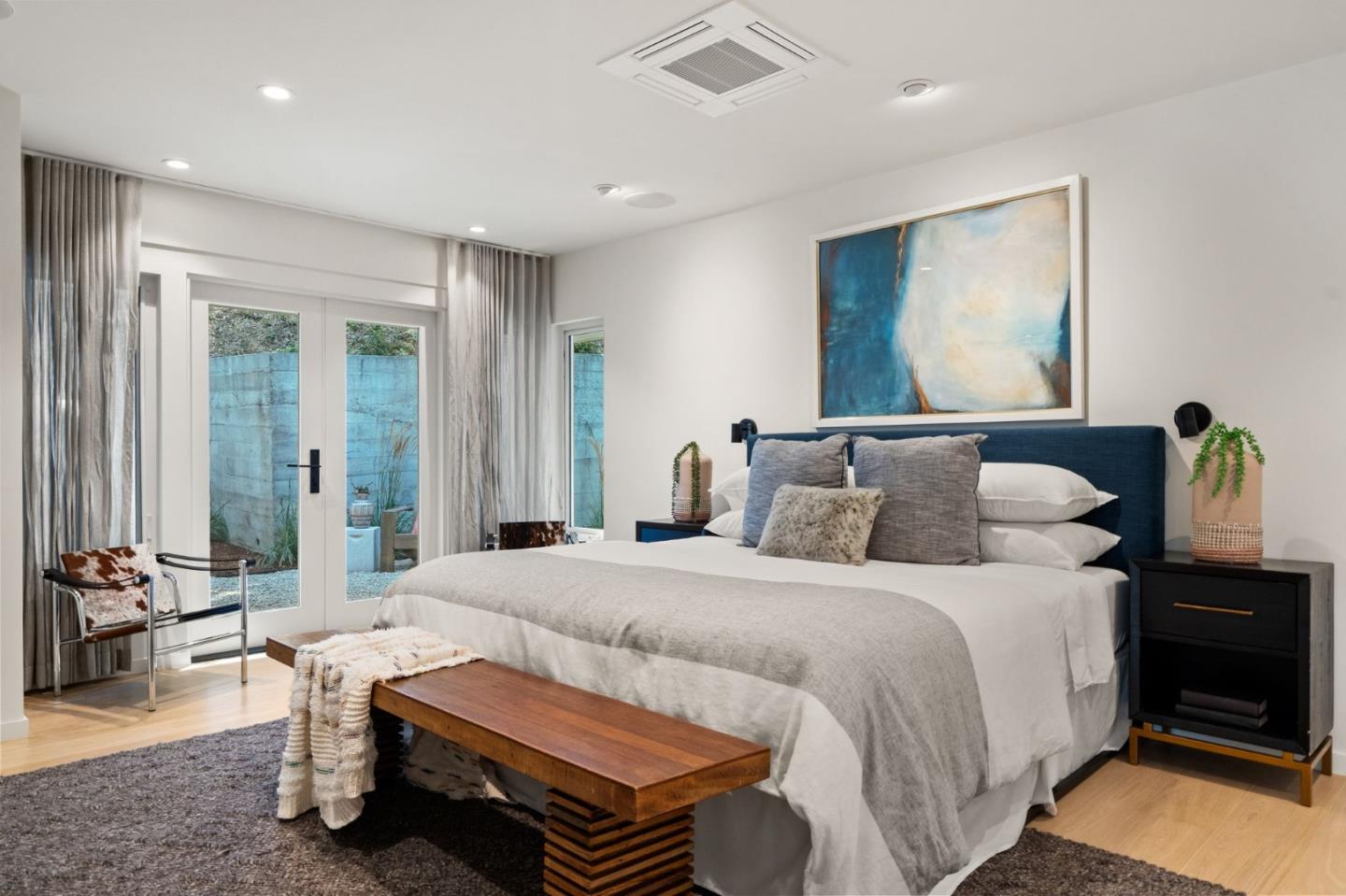 161 Eleanor Drive Woodside, CA 94062 - Photo 14 of 57 a bedroom with a bed and wooden floor