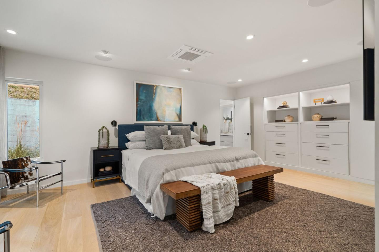 161 Eleanor Drive Woodside, CA 94062 - Photo 15 of 57 a spacious bedroom with a bed and with furniture