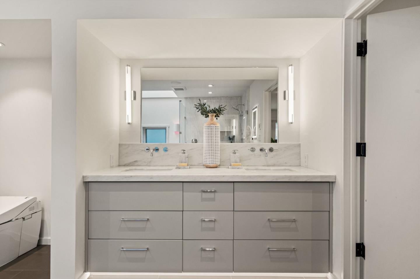 161 Eleanor Drive Woodside, CA 94062 - Photo 18 of 57 a bathroom with a sink and a mirror