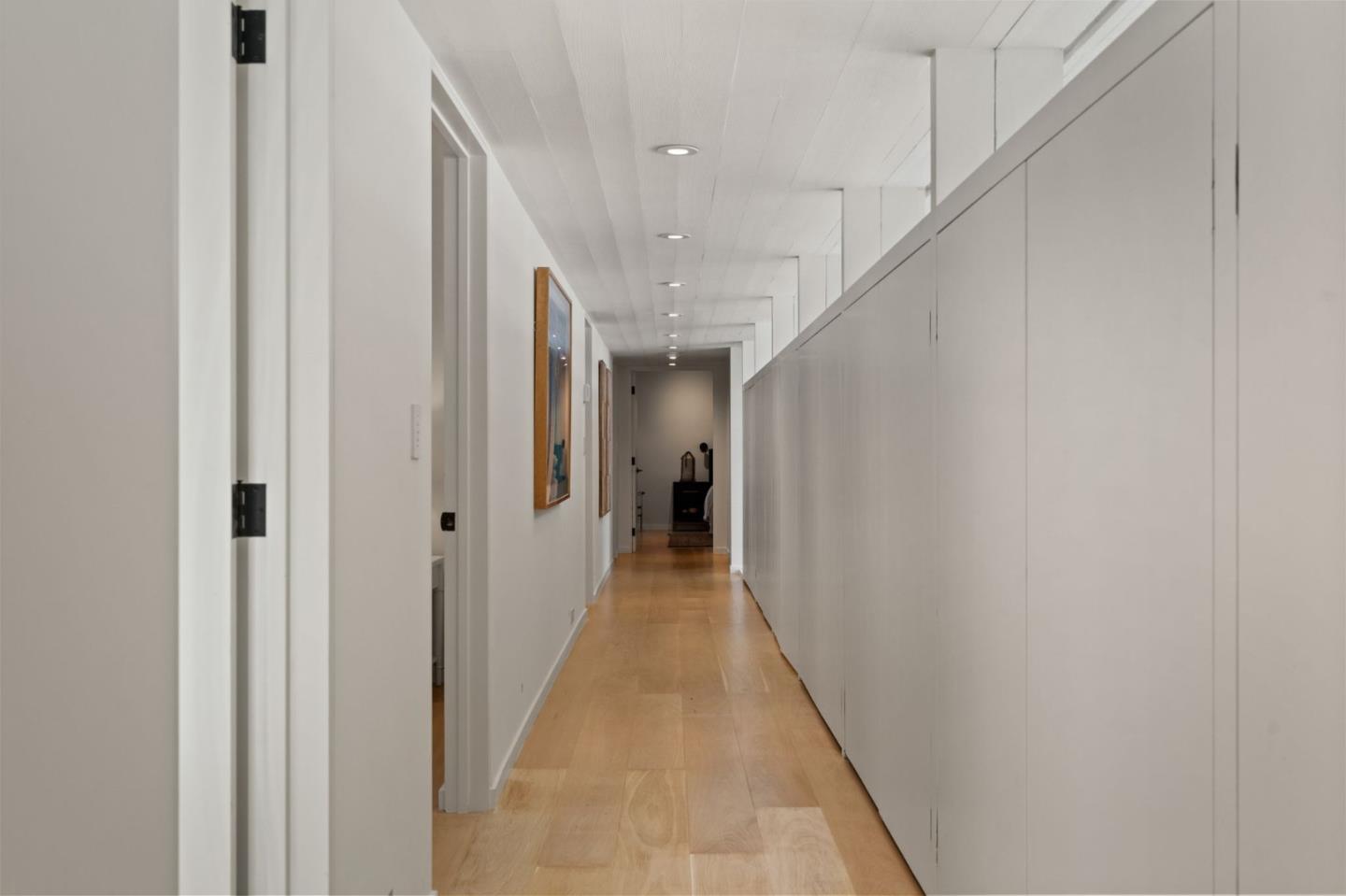 161 Eleanor Drive Woodside, CA 94062 - Photo 20 of 57 a view of a hallway with wooden floor and staircase