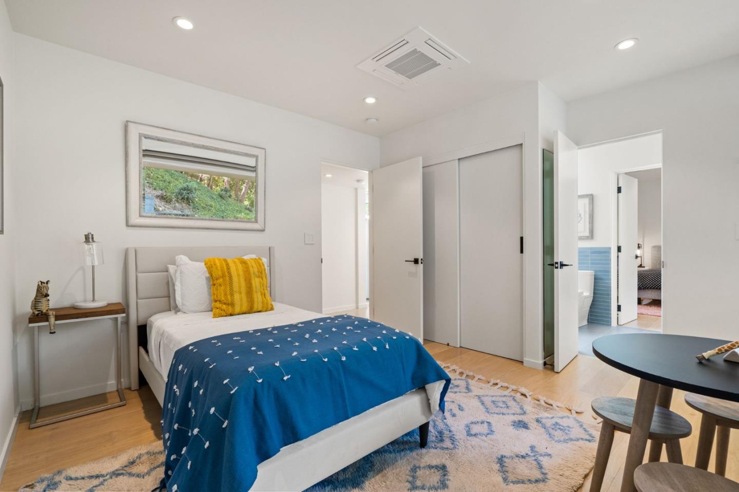 161 Eleanor Drive Woodside, CA 94062 - Photo 21 of 57 a bedroom with a bed and a table in it