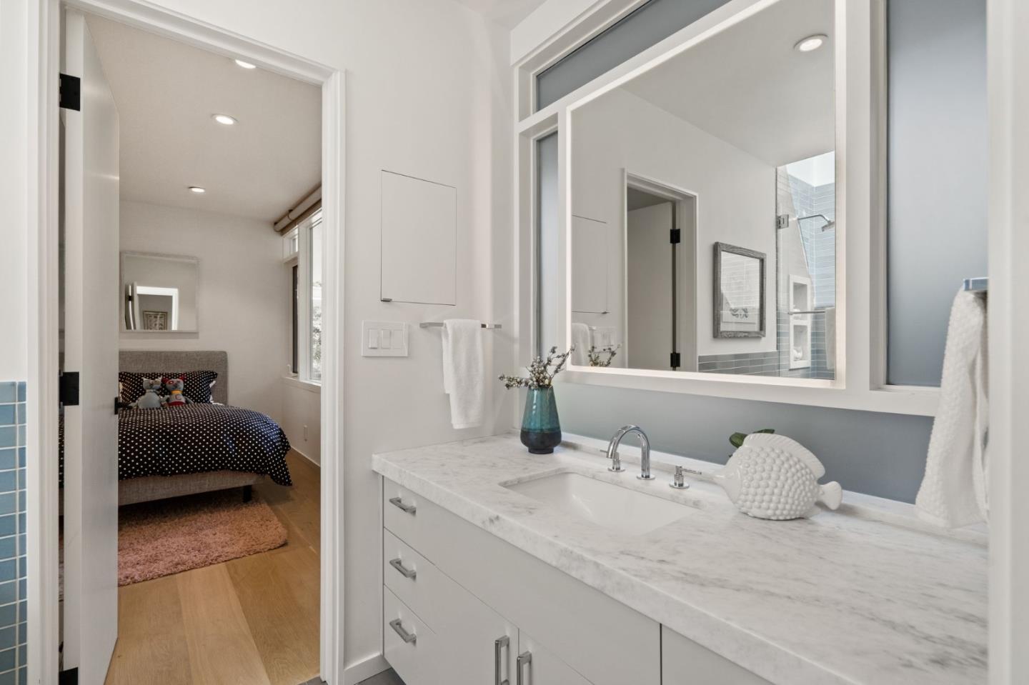 161 Eleanor Drive Woodside, CA 94062 - Photo 26 of 57 a en suite bathroom with a granite countertop sink and a mirror