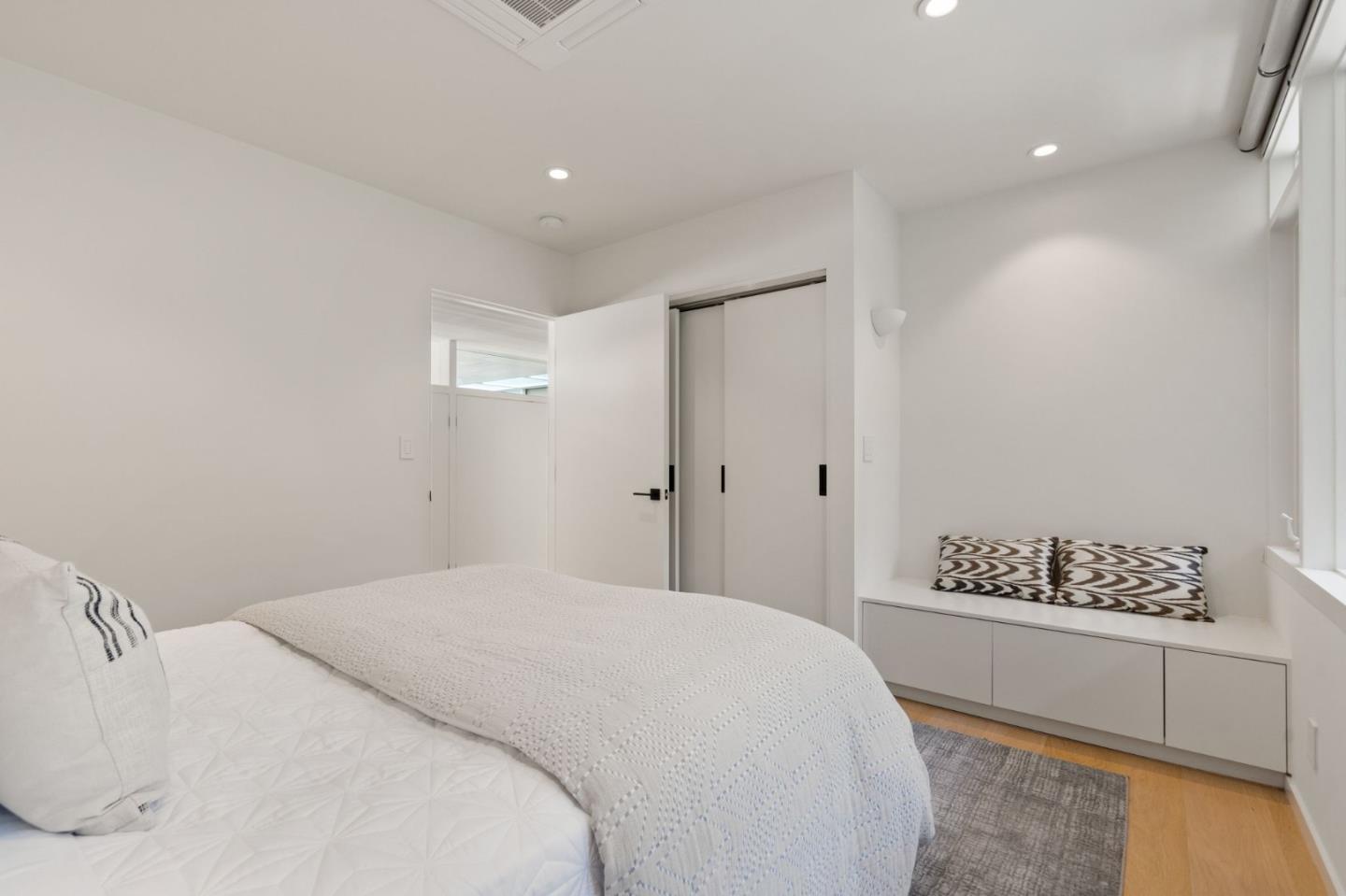 161 Eleanor Drive Woodside, CA 94062 - Photo 27 of 57 a bedroom with a white bed and a dresser