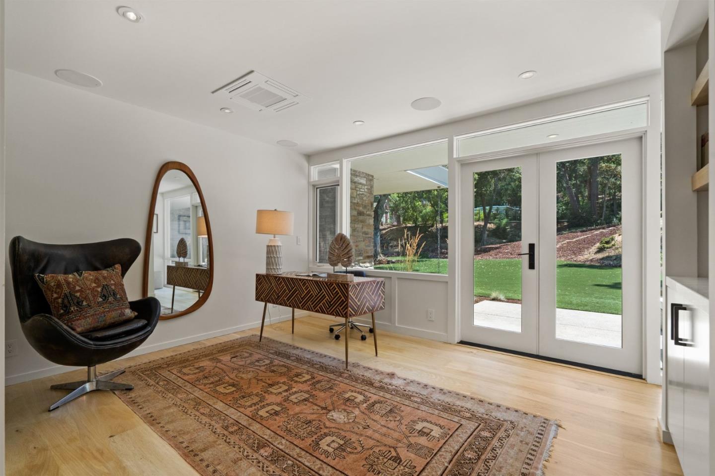 161 Eleanor Drive Woodside, CA 94062 - Photo 29 of 57 a living room with a rug floor to ceiling window and a rug
