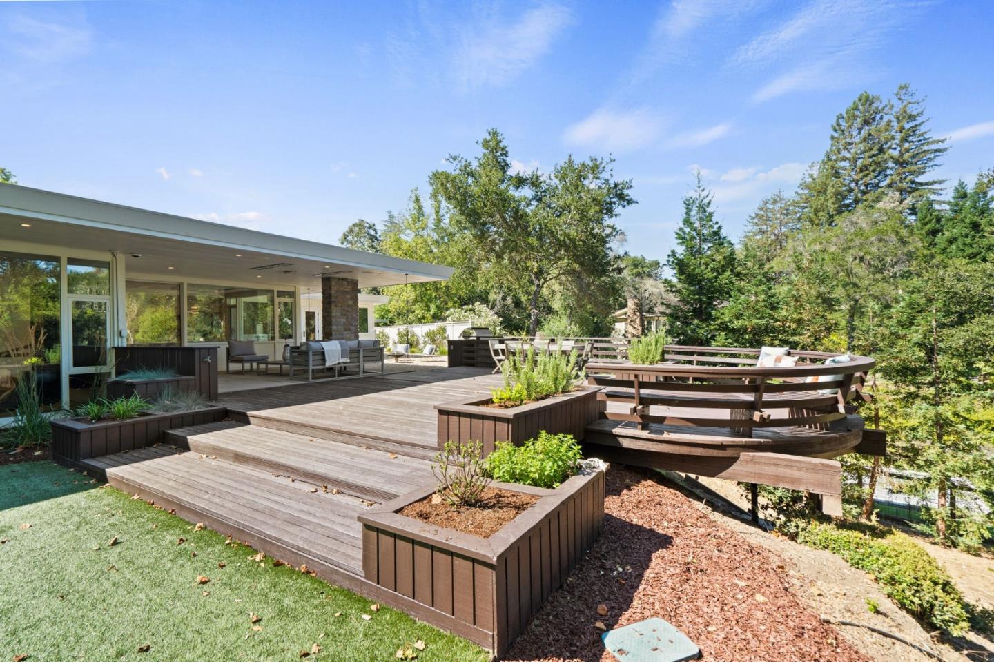 161 Eleanor Drive Woodside, CA 94062 - Photo 44 of 57 a view of a patio with table and chairs with wooden floor and fence
