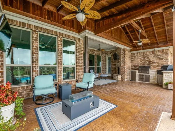 a building outdoor space with patio furniture and potted plants