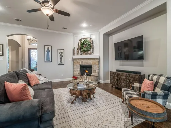 a living room with furniture and a fireplace